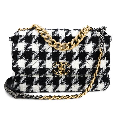 white and black Chanel bag